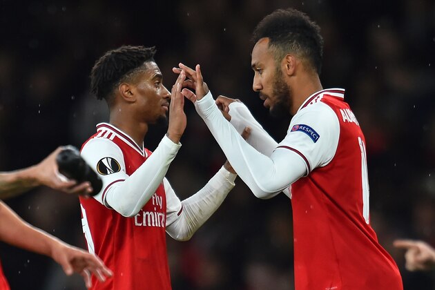 Arsenal's Gabonese striker Pierre-Emerick Aubameyang (R) comes on for Arsenal's English midfielder Reiss Nelson (L) during the UEFA Europa League Group F football match between Arsenal and Standard Liege at the Arsenal Stadium in London on October 3, 2019. (Photo by Glyn KIRK / AFP) (Photo by GLYN KIRK/AFP via Getty Images)