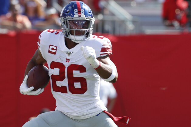 New York Giants running back Saquon Barkley (26) runs the ball against the Tampa Bay Buccaneers during an NFL football game, Sunday, Sept. 22, 2019, in Tampa, Fla. The Giants won the game 32-31. (Jeff Haynes/AP Images for Panini)