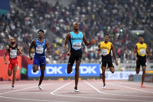 Bahamas' Steven Gardiner (C) reacts as he crosses the finish line and wins in the Men's 400m final at the 2019 IAAF Athletics World Championships at the Khalifa International stadium in Doha on October 4, 2019. (Photo by Jewel SAMAD / AFP) (Photo by JEWEL SAMAD/AFP via Getty Images)