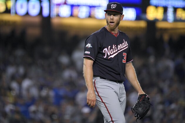 Washington Nationals starting pitcher Stephen Strasburg yells during the sixth inning in Game 2 of the baseball team's National League Division Series against the Los Angeles Dodgers on Friday, Oct. 4, 2019, in Los Angeles. (AP Photo/Mark J. Terrill)