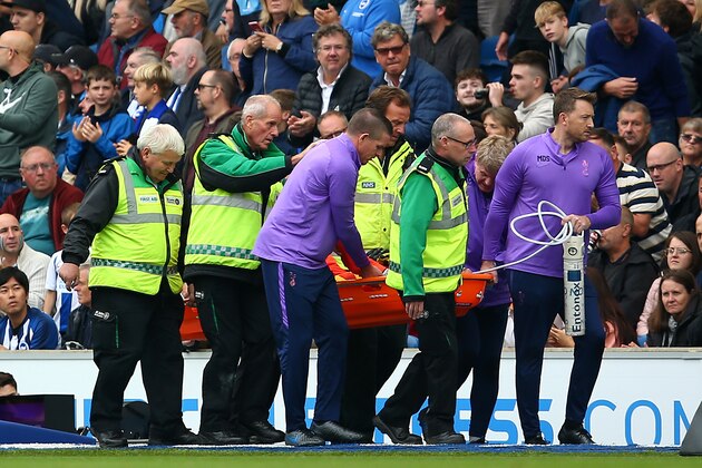 BRIGHTON, ENGLAND - OCTOBER 05: Medical staff attend to Hugo Lloris of Tottenham Hotspur after an injury leading to the opening goal for Brighton and Hove Albion during the Premier League match between Brighton & Hove Albion and Tottenham Hotspur at American Express Community Stadium on October 05, 2019 in Brighton, United Kingdom. (Photo by Charlie Crowhurst/Getty Images)