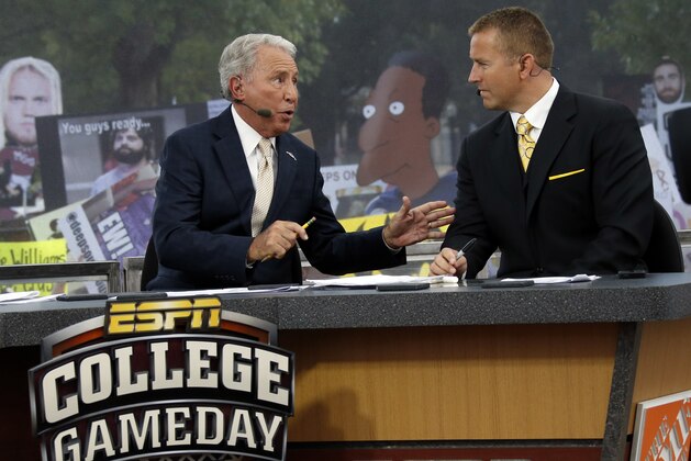 FILE - In this Oct. 11, 2014, file photo, ESPN College GameDay hosts Lee Corso, left, and Kirk Herbstreit confer during the telecast from The Junction prior to Mississippi State playing Auburn in an NCAA college football game in Starkville, Miss. This week the Cornhuskers are front and center. Their game against No. 5 Ohio State on Saturday night was always going to be a big one. Add a visit from ESPN’s “College GameDay” show in the morning, and it becomes huge. (AP Photo/Rogelio V. Solis, File) FILE - In this Oct. 11, 2014, file photo, ESPN College GameDay hosts Lee Corso, left, and Kirk Herbstreit confer during the telecast from The Junction prior to Mississippi State playing Auburn in an NCAA college football game in Starkville, Miss. This week the Cornhuskers are front and center. Their game against No. 5 Ohio State on Saturday night was always going to be a big one. Add a visit from ESPN’s “College GameDay” show in the morning, and it becomes huge. (AP Photo/Rogelio V. Solis, File)