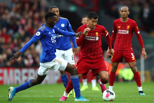 LIVERPOOL, ENGLAND - OCTOBER 05: Roberto Firmino of Liverpool is challenged by Wilfred Ndidi of Leicester City during the Premier League match between Liverpool FC and Leicester City at Anfield on October 05, 2019 in Liverpool, United Kingdom. (Photo by Clive Brunskill/Getty Images)