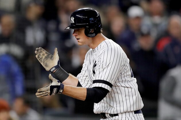 NEW YORK, NEW YORK - OCTOBER 04: DJ LeMahieu #26 of the New York Yankees hits a solo home run against Cody Stashak #61 of the Minnesota Twins during the sixth inning in game one of the American League Division Series at Yankee Stadium on October 04, 2019 in New York City. (Photo by Elsa/Getty Images)