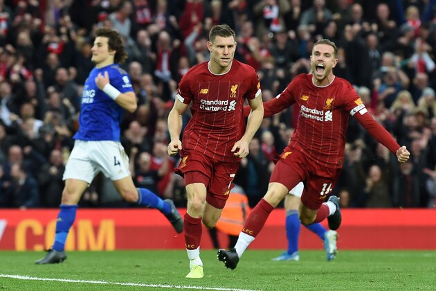 Liverpool's English midfielder James Milner (C) celebrates after he kicks a penalty and scores his team's second goal during the English Premier League football match between Liverpool and Leicester City at Anfield in Liverpool, north west England on October 5, 2019. (Photo by Paul ELLIS / AFP) / RESTRICTED TO EDITORIAL USE. No use with unauthorized audio, video, data, fixture lists, club/league logos or 'live' services. Online in-match use limited to 120 images. An additional 40 images may be used in extra time. No video emulation. Social media in-match use limited to 120 images. An additional 40 images may be used in extra time. No use in betting publications, games or single club/league/player publications. /  (Photo by PAUL ELLIS/AFP via Getty Images)