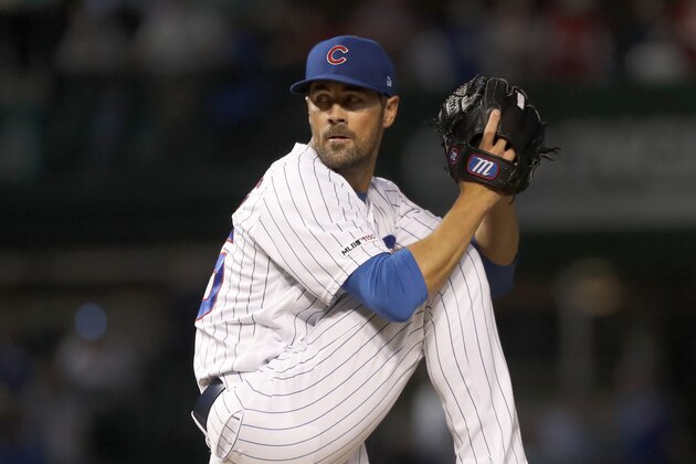 Chicago Cubs starting pitcher Cole Hamels winds up during the first inning of a baseball game against the Cincinnati Reds, Monday, Sept. 16, 2019, in Chicago. (AP Photo/Charles Rex Arbogast)