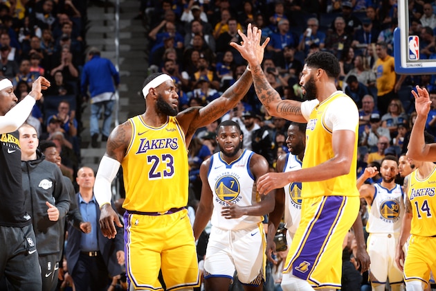 SAN FRANCISCO, CA - OCTOBER 5: LeBron James #23 and Anthony Davis #3 of the Los Angeles Lakers high-five during a pre-season game against the Golden State Warriors on October 5, 2019 at Chase Center in San Francisco, California. NOTE TO USER: User expressly acknowledges and agrees that, by downloading and/or using this Photograph, user is consenting to the terms and conditions of the Getty Images License Agreement. Mandatory Copyright Notice: Copyright 2019 NBAE (Photo by Noah Graham/NBAE via Getty Images)