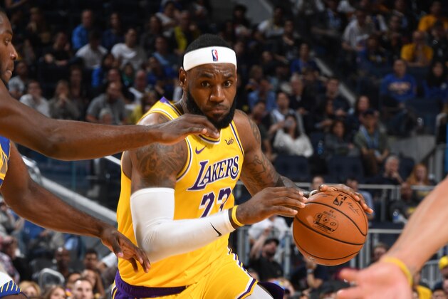 LOS ANGELES, CA - OCTOBER 5: LeBron James #23 of the Los Angeles Lakers drives to the basket against the Golden State Warriors during the preseason on October 5, 2019 at Oakland Arena in San Francisco, California. NOTE TO USER: User expressly acknowledges and agrees that, by downloading and/or using this Photograph, user is consenting to the terms and conditions of the Getty Images License Agreement. Mandatory Copyright Notice: Copyright 2019 NBAE (Photo by Andrew D. Bernstein/NBAE via Getty Images)