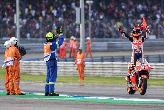 Repsol Honda Team Spanish rider Marc Marquez celebrates on the track after winning the MotoGP race for the Thailand Grand Prix at Buriram International Circuit in Buriram on October 6, 2019. (Photo by Lillian SUWANRUMPHA / AFP) (Photo by LILLIAN SUWANRUMPHA/AFP via Getty Images)