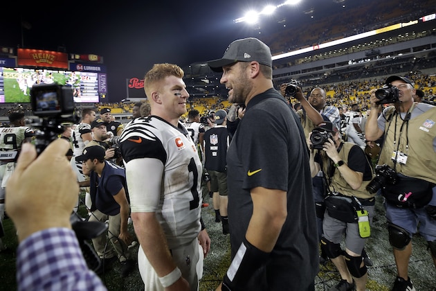 Injured Pittsburgh Steelers quarterback Ben Roethlisberger, right center, talks with Cincinnati Bengals quarterback Andy Dalton (14) following an NFL football game in Pittsburgh, Monday, Sept. 30, 2019. The Steelers won 27-3. (AP Photo/Don Wright)
