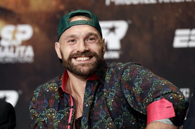 Tyson Fury smiles during a news conference Wednesday, Sept. 11, 2019, in Las Vegas. Fury will face Otto Wallin in a heavyweight boxing match Saturday. (AP Photo/Isaac Brekken)