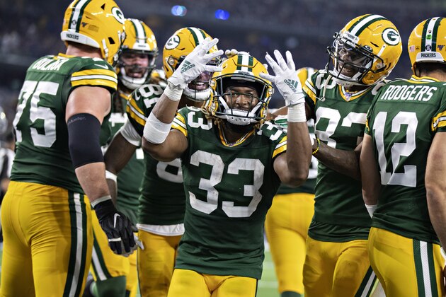 ARLINGTON, TX - OCTOBER 6: Aaron Jones #33 of the Green Bay Packers celebrates after scoring his fourth touchdown during a game against the Dallas Cowboys at AT&T Stadium on October 6, 2019 in Arlington, Texas.   (Photo by Wesley Hitt/Getty Images)