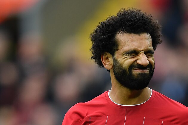 Liverpool's Egyptian midfielder Mohamed Salah reacts during the English Premier League football match between Liverpool and Leicester City at Anfield in Liverpool, north west England on October 5, 2019. (Photo by Paul ELLIS / AFP) / RESTRICTED TO EDITORIAL USE. No use with unauthorized audio, video, data, fixture lists, club/league logos or 'live' services. Online in-match use limited to 120 images. An additional 40 images may be used in extra time. No video emulation. Social media in-match use limited to 120 images. An additional 40 images may be used in extra time. No use in betting publications, games or single club/league/player publications. /  (Photo by PAUL ELLIS/AFP via Getty Images)