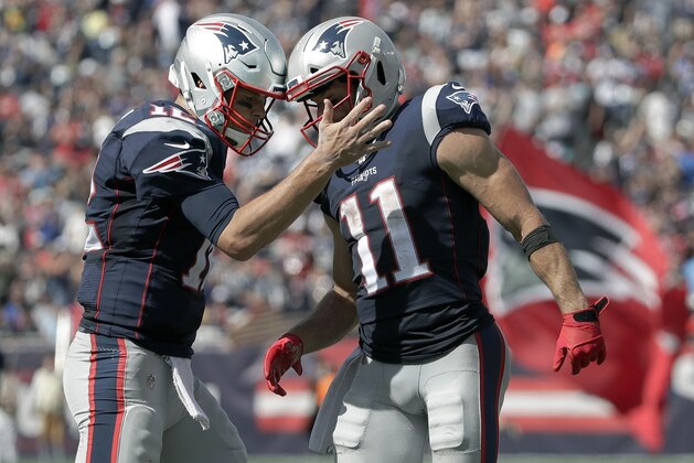 New England Patriots quarterback Tom Brady, left, celebrates his touchdown pass to Julian Edelman, right, in the first half of an NFL football game against the New York Jets, Sunday, Sept. 22, 2019, in Foxborough, Mass. (AP Photo/Elise Amendola)