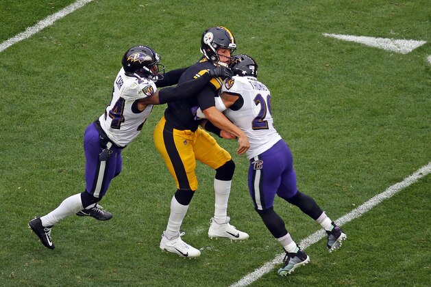 PITTSBURGH, PA - OCTOBER 06:  Mason Rudolph #2 of the Pittsburgh Steelers is injured on the play as he is tackled by Earl Thomas #29 and Brandon Carr #24 of the Baltimore Ravens on October 6, 2019 at Heinz Field in Pittsburgh, Pennsylvania.  (Photo by Justin K. Aller/Getty Images)