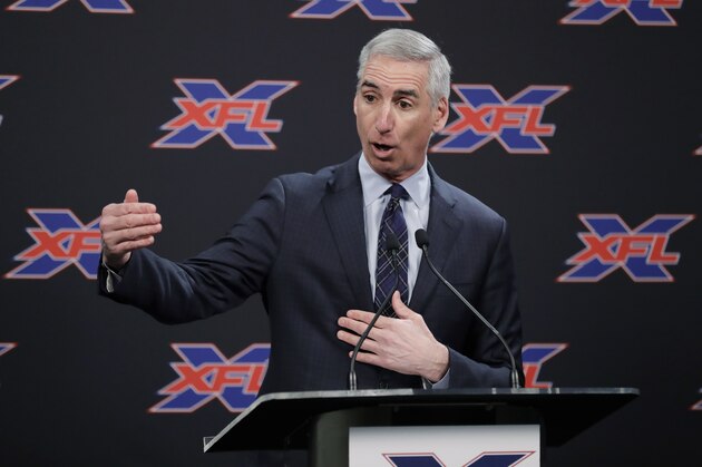 XFL Football Commissioner Oliver Luck talks to reporters before introducing former NFL football quarterback Jim Zorn as the head coach for Seattle's XFL football team, Monday, Feb. 25, 2019, in Seattle. The team will begin play in 2020. (AP Photo/Ted S. Warren)