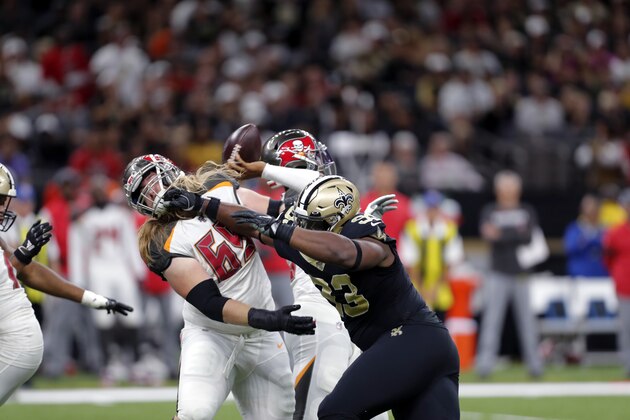 New Orleans Saints defensive tackle David Onyemata (93) battles against Tampa Bay Buccaneers offensive guard Alex Cappa (65) in the first half of an NFL football game in New Orleans, Sunday, Oct. 6, 2019. (AP Photo/Gerald Herbert)