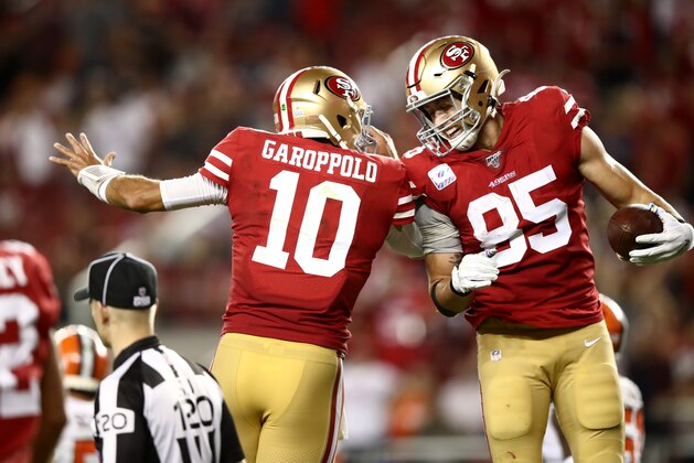 SANTA CLARA, CALIFORNIA - OCTOBER 07:  George Kittle #85 is congratulated by Jimmy Garoppolo #10 of the San Francisco 49ers after Garoppolo threw a touchdown pass to Kittle against the Cleveland Browns at Levi's Stadium on October 07, 2019 in Santa Clara, California. (Photo by Ezra Shaw/Getty Images)