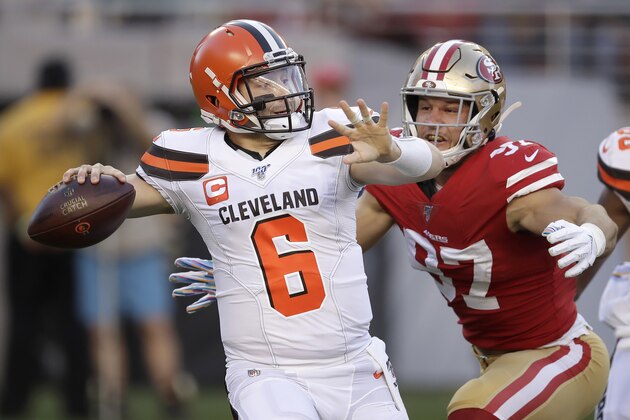 Cleveland Browns quarterback Baker Mayfield (6) passes as San Francisco 49ers defensive end Nick Bosa applies pressure during the first half of an NFL football game in Santa Clara, Calif., Monday, Oct. 7, 2019. (AP Photo/Ben Margot)