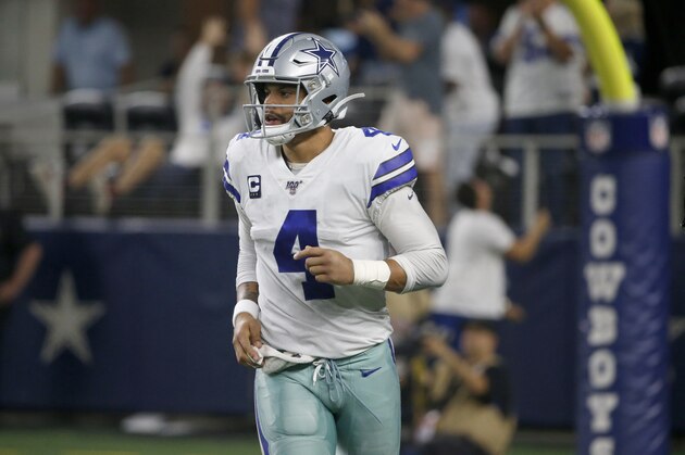 Dallas Cowboys' Dak Prescott (4) jogs across the field in the second half of an NFL football game against the Green Bay Packers in Arlington, Texas, Sunday, Oct. 6, 2019. (AP Photo/Ron Jenkins)