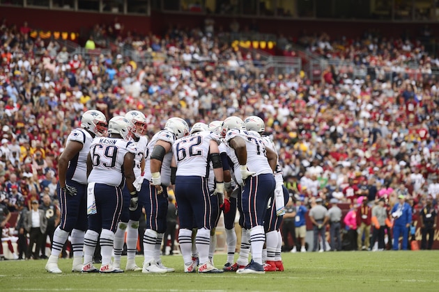 LANDOVER, MD - OCTOBER 06: The New England Patriots huddle before a play in the first half against the Washington Redskins at FedExField on October 6, 2019 in Landover, Maryland. (Photo by Patrick McDermott/Getty Images)