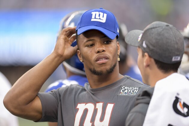 New York Giants running back Saquon Barkley (26) watches play from the sidelines against the Minnesota Vikings during an NFL football game, Sunday, Oct. 6, 2019, in East Rutherford, N.J. (AP Photo/Bill Kostroun)