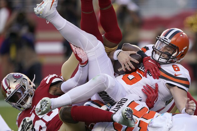 Cleveland Browns quarterback Baker Mayfield (6) is sacked by San Francisco 49ers middle linebacker Kwon Alexander, left, and K'Waun Williams during the first half of an NFL football game in Santa Clara, Calif., Monday, Oct. 7, 2019. (AP Photo/Tony Avelar)