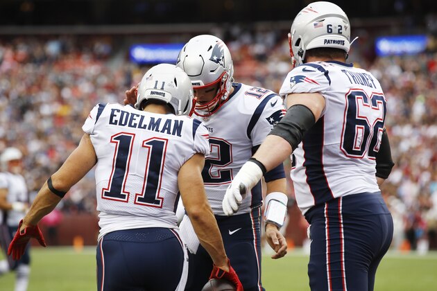 New England Patriots wide receiver Julian Edelman (11) celebrates his touchdown with New England Patriots quarterback Tom Brady (12) during the first half of an NFL football game, Sunday, Oct. 6, 2019, in Landover, Md. (AP Photo/Patrick Semansky)