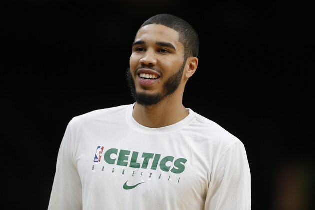 Boston Celtics' Jayson Tatum warms up before a preseason NBA basketball game against the Charlotte Hornets in Boston, Sunday, Oct. 6, 2019. (AP Photo/Michael Dwyer)