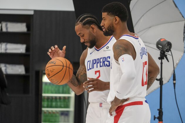 Los Angeles Clippers forwards Kawhi Leonard, Paul George attend the NBA basketball team's media day in Los Angeles Sunday, Sept. 29, 2019. (AP Photo/Ringo H.W. Chiu)