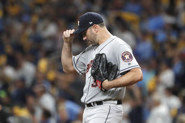 Houston Astros' Justin Verlander adjusts his cap while pitching in the third inning of Game 4 of a baseball American League Division Series against the Tampa Bay Rays, Tuesday, Oct. 8, 2019, in St. Petersburg, Fla. (AP Photo/Scott Audette)