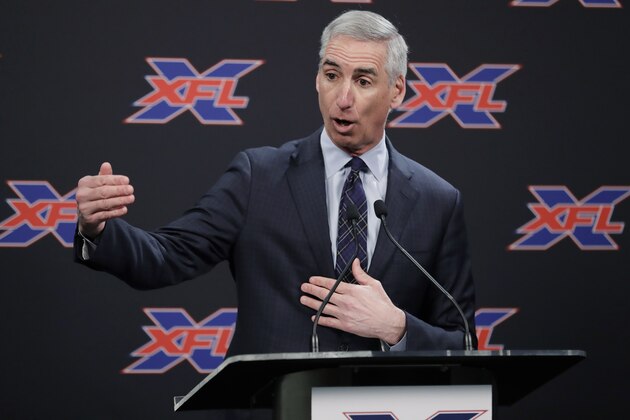 FILE - In this Feb. 25, 2019, file photo, XFL Football Commissioner Oliver Luck talks to reporters before introducing former NFL football quarterback Jim Zorn as the head coach for Seattle's XFL football team, in Seattle. Oliver Luck’s first year as the XFL’s commissioner has mostly been confined to the office and getting the league’s framework set up. The next couple months though are what Luck refers to as the fun part of preparing for next year’s return. (AP Photo/Ted S. Warren, File)