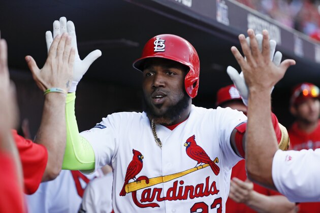 St. Louis Cardinals' Marcell Ozuna celebrates after hitting a solo home run during the first inning in Game 4 of a baseball National League Division Series against the Atlanta Braves, Monday, Oct. 7, 2019, in St. Louis. (AP Photo/Jeff Roberson)