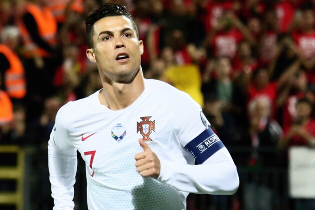 Portugal's forward Cristiano Ronaldo celebrates scoring the opening goal  during the UEFA Euro 2020 Group B qualification football match Lithuania v Portugal in Vilnius, Lithuania, on September 10, 2019. (Photo by Petras Malukas / AFP)        (Photo credit should read PETRAS MALUKAS/AFP/Getty Images)