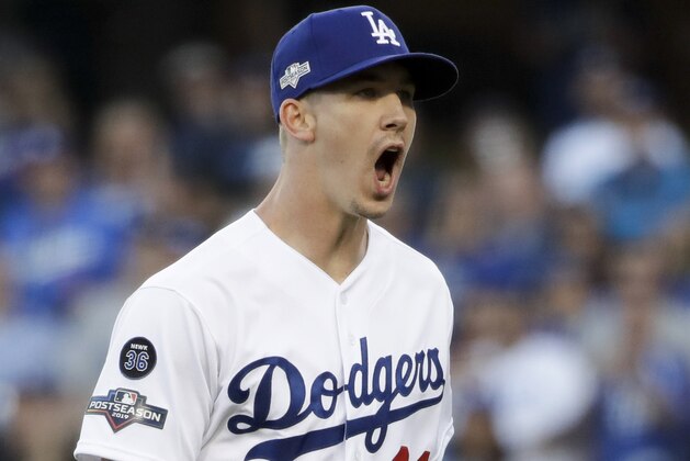 Los Angeles Dodgers starting pitcher Walker Buehler reacts after striking out Washington Nationals' Anthony Rendon to end the top of the first inning of Game 1 in baseball's National League Divisional Series on Thursday, Oct. 3, 2019, in Los Angeles. (AP Photo/Marcio Jose Sanchez)