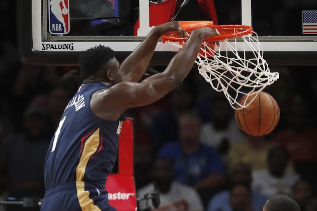 New Orleans Pelicans forward Zion Williamson (1) scores during the first half of a preseason NBA basketball game against the Atlanta Hawks, Monday, Oct. 7, 2019, in Atlanta. (AP Photo/John Bazemore)