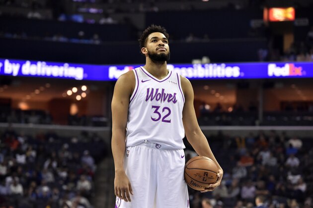 Minnesota Timberwolves center Karl-Anthony Towns (32) plays in the second half of an NBA basketball game against the Memphis Grizzlies Saturday, March 23, 2019, in Memphis, Tenn. (AP Photo/Brandon Dill)