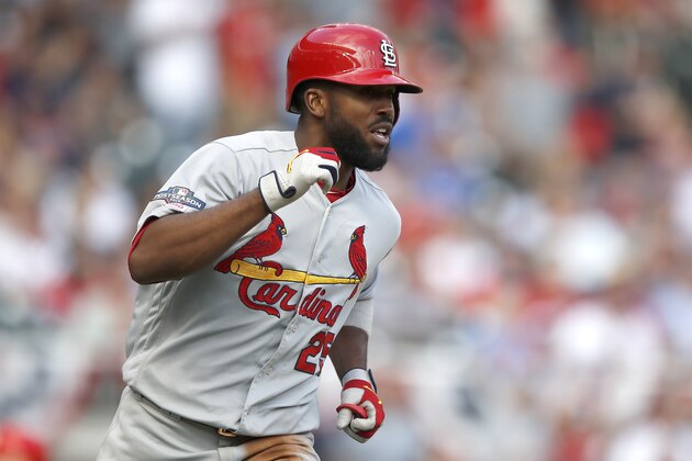 ATLANTA, GEORGIA - OCTOBER 09:  Dexter Fowler #25 of the St. Louis Cardinals celebrates after scoring his second run of the first inning against the Atlanta Braves in game five of the National League Division Series at SunTrust Park on October 09, 2019 in Atlanta, Georgia. (Photo by Todd Kirkland/Getty Images)