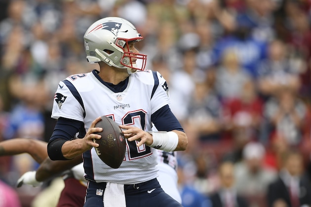 New England Patriots quarterback Tom Brady (12) works against the Washington Redskins during the first half of an NFL football game, Sunday, Oct. 6, 2019, in Landover, Md. (AP Photo/Nick Wass)