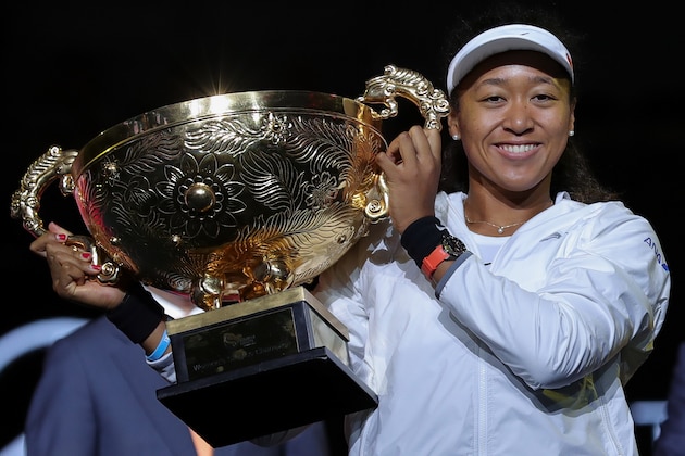 BEIJING, CHINA - OCTOBER 06:  Naomi Osaka of Japan poses with the trophy during the medal ceremony after the Women's singles final match against Ashleigh Barty of Australia on day 9 of the 2019 China Open at the China National Tennis Center on October 06, 2019 in Beijing, China.  (Photo by Lintao Zhang/Getty Images)