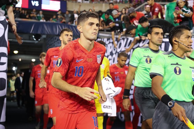 CHICAGO, IL - JULY 07: Christian Pulisic leading his USA team out onto Soldier Field for the 2019 CONCACAF Gold Cup Final between Mexico and United States of America at Soldier Field on July 7, 2019 in Chicago, Illinois. (Photo by Matthew Ashton - AMA/Getty Images)