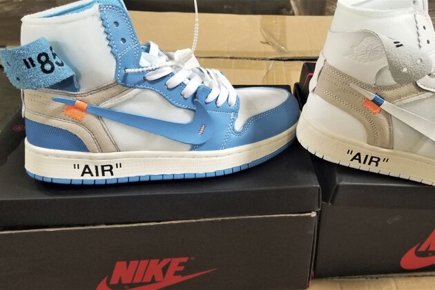 This undated photo provided by U.S. Customs and Border Protection shows some of more than 14,800 pair of counterfeit Nike shoes, seized in a shipment arriving from China at the Los Angeles-Long Beach sports complex. The agency said Wednesday, Oct. 9, 2019 that had the fake special edition and retro design shoes been real, the manufacturer's suggested retail prices would have totaled more than $2.2 million. The agency says the shoes violated trademarks for various versions of Nike's Air Jordan and Air Max shoes. (U.S. Customs and Border Protection via AP)