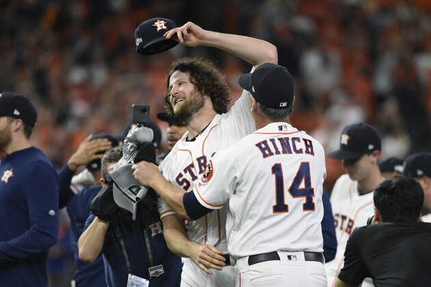 Houston Astros starting pitcher Gerrit Cole (45) celebrates with manager AJ Hinch (14) after the team's win in Game 5 of a baseball American League Division Series against the Tampa Bay Rays in Houston, Thursday, Oct. 10, 2019. Houston won 6-1. (AP Photo/Eric Christian Smith)