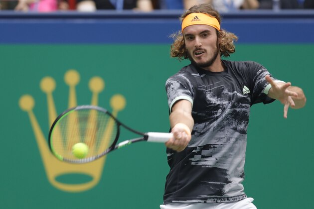 SHANGHAI, CHINA - OCTOBER 11: Stefanos Tsitsipas of Greece action against Novak Djokovic of Serbia during the Men's singles Quarterfinals match of 2019 Rolex Shanghai Masters day seven at Qi Zhong Tennis Centre on October 11, 2019 in Shanghai, China. (Photo by Fred Lee/Getty Images)