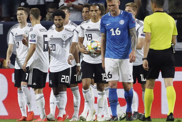 Germany's players celebrate their side's sixth goal during a Group C soccer qualifying match between Germany and Estonia in Mainz, Germany, Tuesday, June 11, 2019. (AP Photo/Michael Probst)