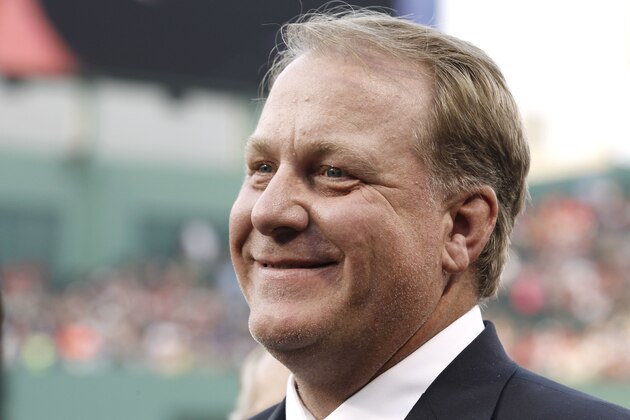 FILE - This Aug. 3, 2012, file photo, shows former Boston Red Sox pitcher Curt Schilling smiling after being introduced at Fenway Park in Boston. Schilling says he's thinking about running for Congress in Arizona. Schilling confirmed in an email to The Arizona Republic on Monday, Aug. 12, 2019, that he's considering a run. He declined to say which district he'd run in and wrote that