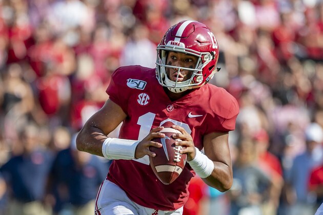 Alabama quarterback Tua Tagovailoa (13) rolls out against Mississippi during the first half of an NCAA college football game, Saturday, Sept. 28, 2019, in Tuscaloosa, Ala. (AP Photo/Vasha Hunt)