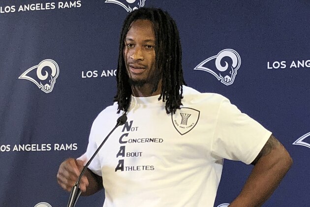 Los Angeles Rams running back Todd Gurley wears a shirt reading