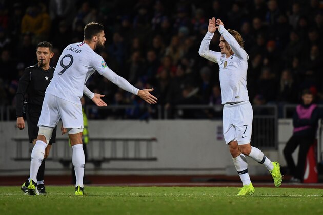 France's forward Olivier Giroud (L) celebrates scoring the opening goal with his teammate forward Antoine Griezmann during the UEFA Euro 2020 qualifier Group H football match Iceland v France in Reykjavik on October 11, 2019. (Photo by Jonathan NACKSTRAND / AFP) (Photo by JONATHAN NACKSTRAND/AFP via Getty Images)