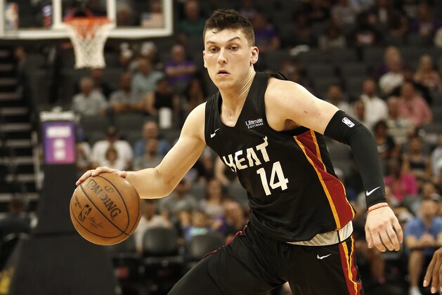 In this photo taken July 1, 2019, Miami Heat guard Tyler Herro dribbles down court against the Los Angeles Lakers during the second half of an NBA basketball summer league game in Sacramento, Calif., Monday, July 1, 2019. The Heat won 106-79. (AP Photo/Rich Pedroncelli)